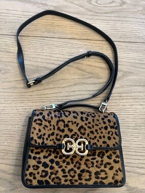 Sam Edelman Christy top handle Crossbody bag in a leopard print.